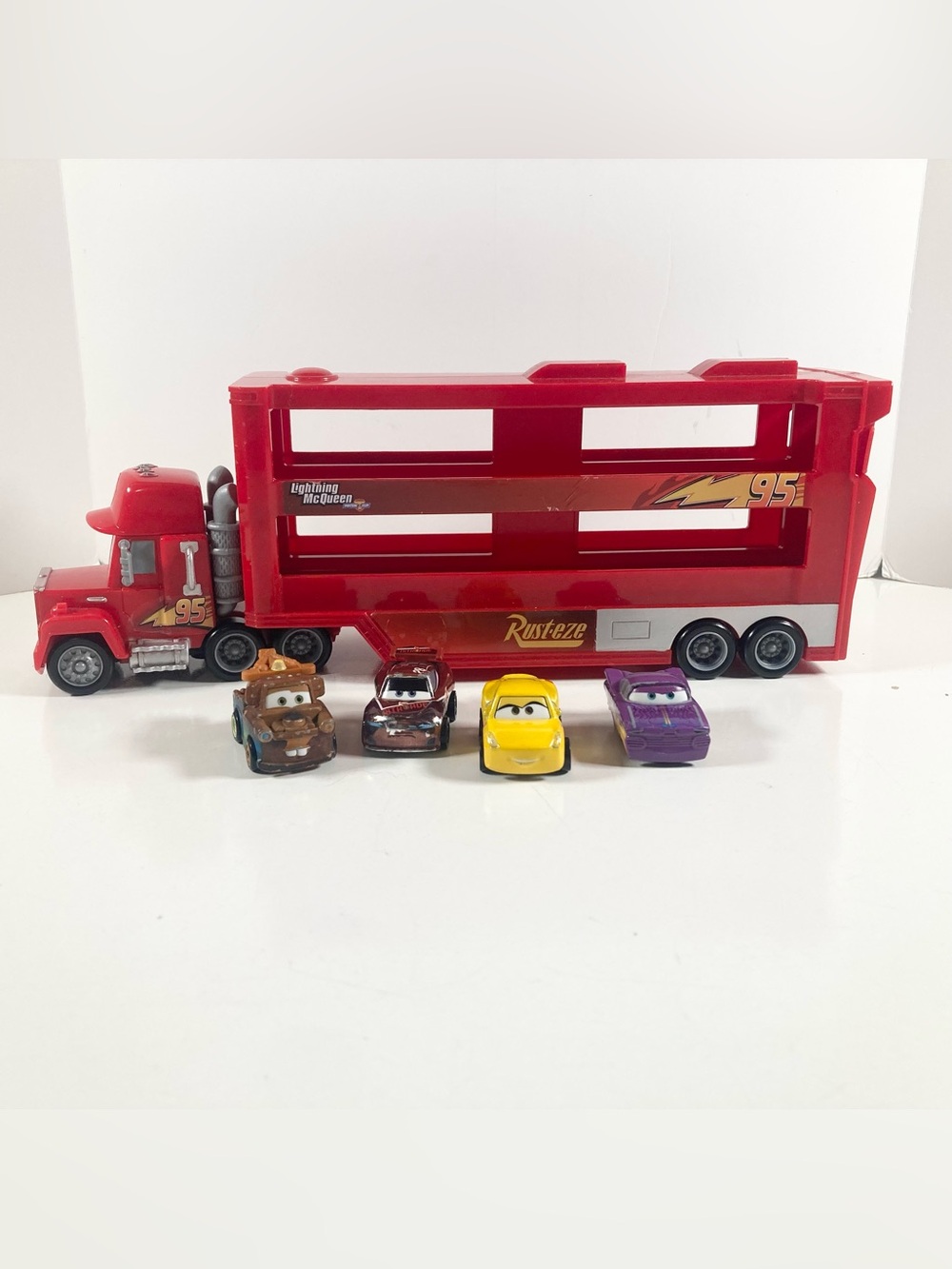 Disney Pixar Cars Movie Mack Hauler for Mini Racer Cars with 4 Mini Cars